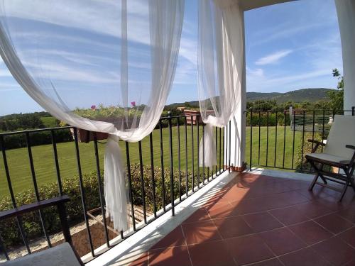 a balcony with a view of a field at Il Pagio in Alghero