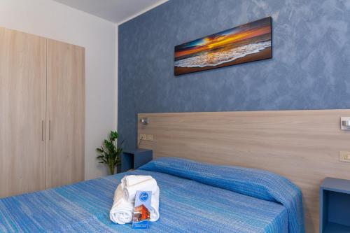 Postel nebo postele na pokoji v ubytování Hotel Laura