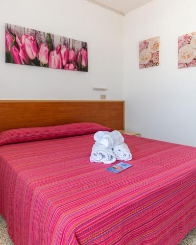 Postel nebo postele na pokoji v ubytování Hotel Laura