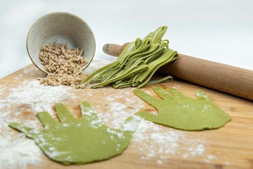 a cutting board with a bunch of green vegetables on it at Relais Chiaramonte in Ragusa