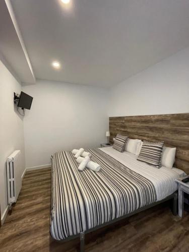 Postel nebo postele na pokoji v ubytování Aparthotel Sant Andreu