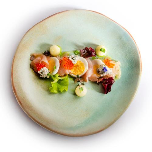 a plate of food with vegetables and eggs on it at Hiša Linhart, Hotel & Restaurant in Radovljica