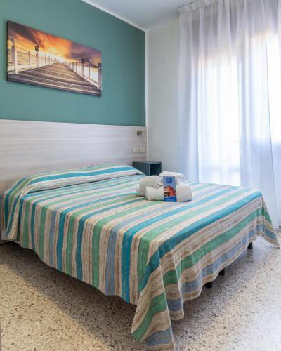 Postel nebo postele na pokoji v ubytování Hotel Laura