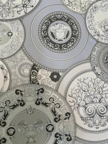 a ceiling filled with lots of plates and dishes at 2 Bedroom Apartment at SECC Hydro FREE PARKING in Glasgow