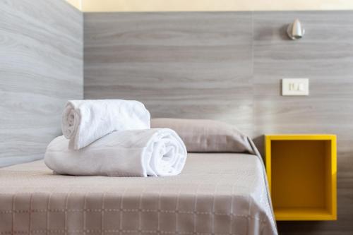 Postel nebo postele na pokoji v ubytování Hotel Laura