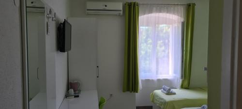a room with a window and a bed at Nirvana Rooms & Apartments in Split