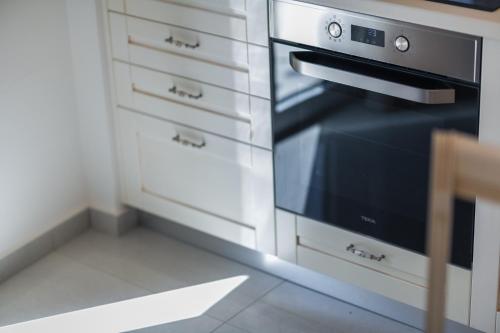 Η κουζίνα ή μικρή κουζίνα στο Narya Luxury Apartment