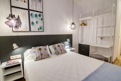 Postel nebo postele na pokoji v ubytování Hostal La Isla