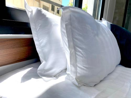 Letto o letti in una camera di Urban Habitat Executive Suites