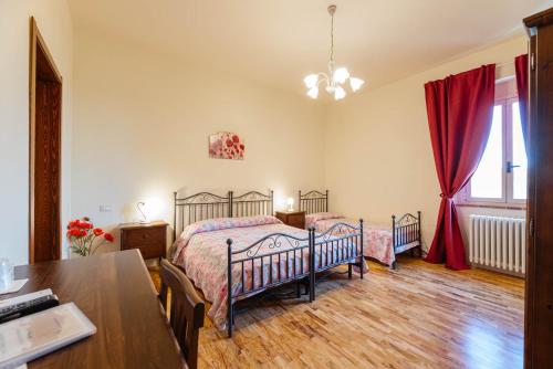Ένα ή περισσότερα κρεβάτια σε δωμάτιο στο Agriturismo Villa Bracali