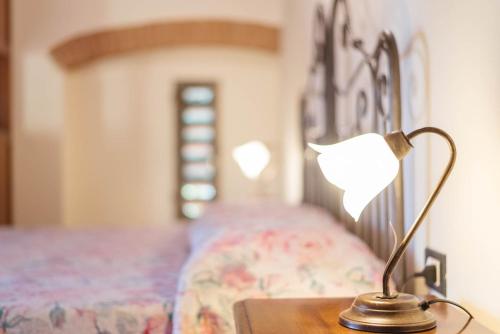 Ένα ή περισσότερα κρεβάτια σε δωμάτιο στο Agriturismo Villa Bracali