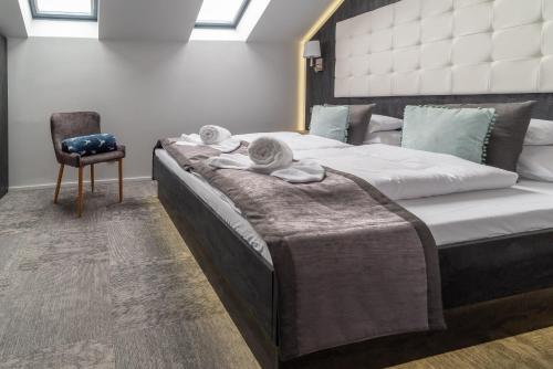 Postel nebo postele na pokoji v ubytování Arany Apartman Miskolc
