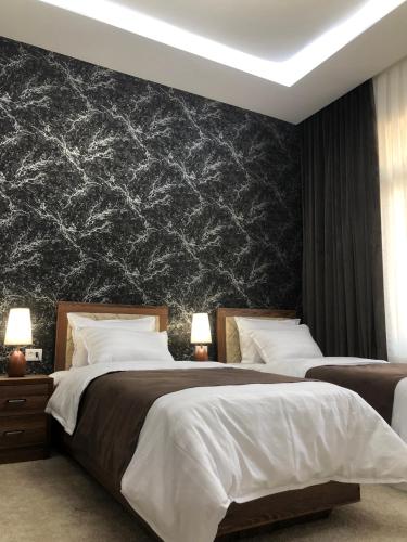 Кровать или кровати в номере Sabrina Hotel