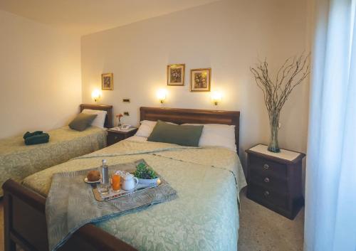 Un pat sau paturi într-o cameră la Hotel Da Gigi