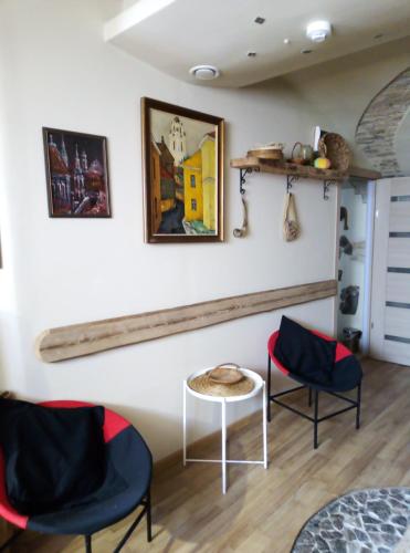 a room with two chairs and a table at HelloVilniusHostel in Vilnius