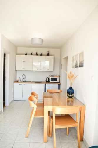 Kuchyň nebo kuchyňský kout v ubytování Apartments Lakeview