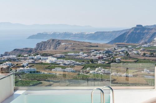 a bath tub with a view of the ocean at Phaos 1870, A restored Winery in Pirgos