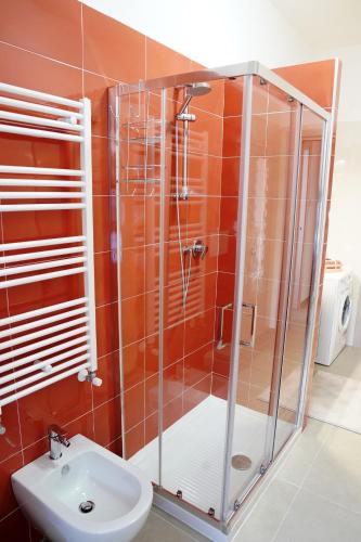 a bathroom with a shower and a sink at Vesuvius' Lovely Inn in Ercolano