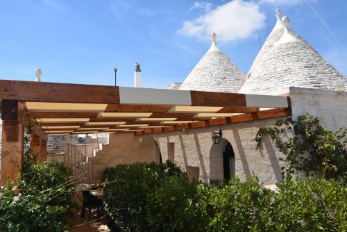 a building with two spires on top of it at Quei Trulli Divini in Martina Franca