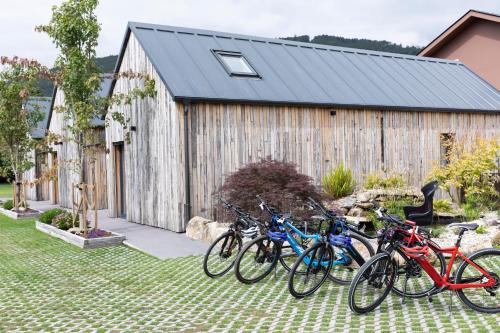 a group of bikes parked in front of a building at Casitas de Madera O Loureiro in Noya