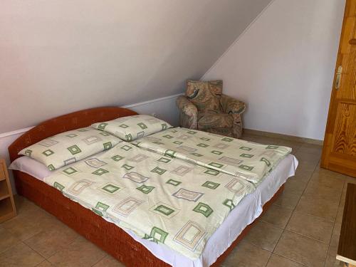 Кровать или кровати в номере Abigél Apartmanház