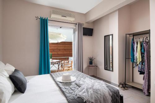 a bedroom with a bed with a table on it at Epohikon Studios in Sarti