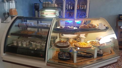 a display case filled with different types of food at Hotel La Baia in Ponza