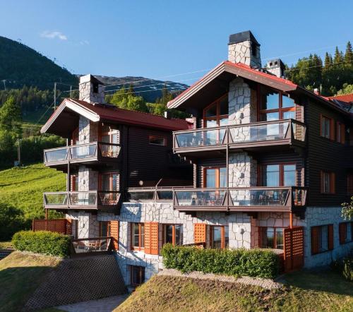 a large house with balconies on the side of it at Åre Travel - Tottbacken in Åre