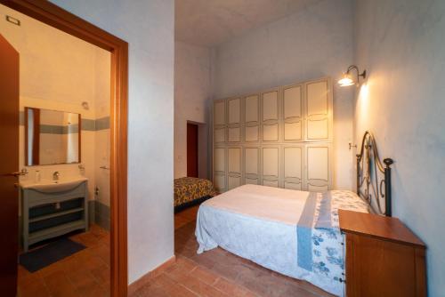 Krevet ili kreveti u jedinici u okviru objekta Dimora Terrazza sui Calanchi