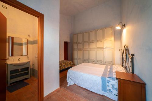 Postel nebo postele na pokoji v ubytování Dimora Terrazza sui Calanchi