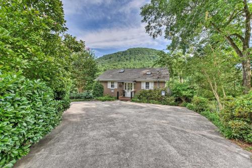 an empty driveway to a house with a mountain at Cozy Cabin on Tenn River - 10 Mi to Chattanooga! in Chattanooga