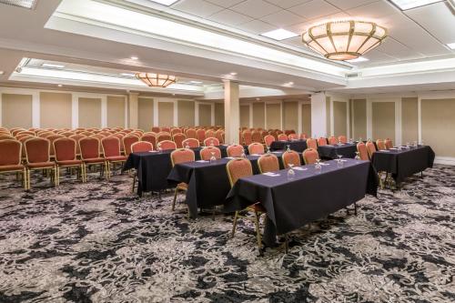 a conference room with tables and chairs and lights at Wingate Houston near NRG Park/Medical Center in Houston