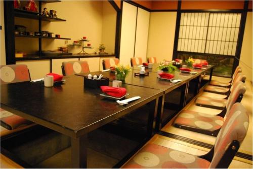 a dining room with a long table and chairs at Seri Pacific Hotel Kuala Lumpur in Kuala Lumpur