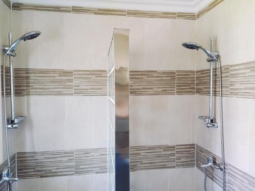 a shower with a glass door in a bathroom at Monísimo Pensión Rincón de la Victoria in Rincón de la Victoria