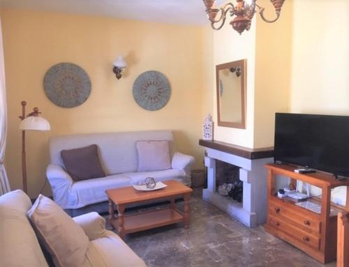 TV a/nebo společenská místnost v ubytování Apartamentos Acevedo Centro I