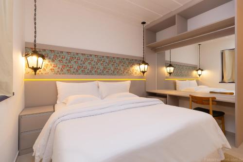 Ein Bett oder Betten in einem Zimmer der Unterkunft Pousada Aconchego