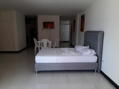Letto o letti in una camera di Apto704 CON VISTA AL MAR BAHÍA DE SANTA MARTA
