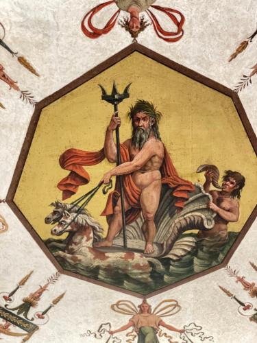 a painting of a man holding a trident at Palazzo Forlani in Capranica