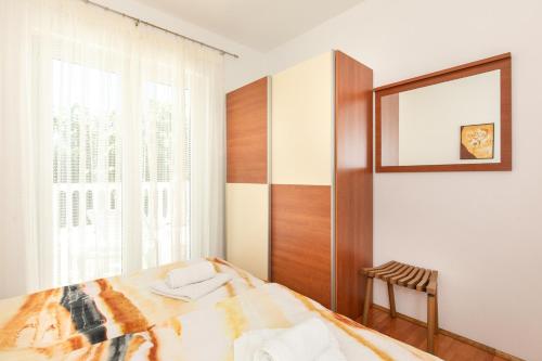 Postel nebo postele na pokoji v ubytování Apartman Marjeto