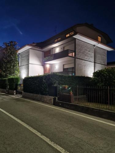 a house with lights on in front of a street at Casa vacanza Orio al Serio Bergamo in Orio al Serio