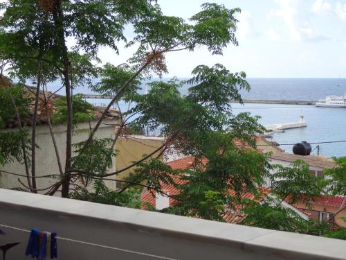a view of the ocean from a balcony at Remezzo Hotel & Studios in Pythagoreio
