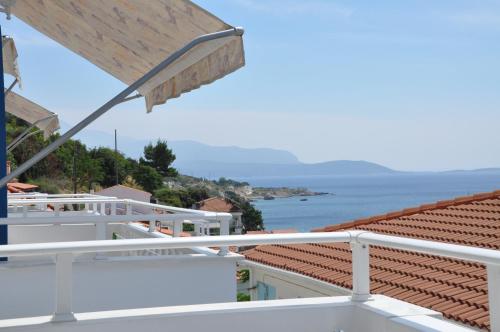 a view of the ocean from the balcony of a house at Remezzo Hotel & Studios in Pythagoreio