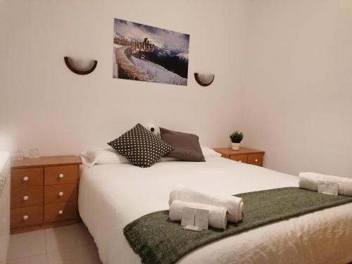 Ένα ή περισσότερα κρεβάτια σε δωμάτιο στο Albergue Cervera de Pisuerga