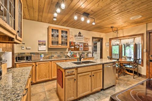 a large kitchen with wooden cabinets and a sink at Family Home in Georgetown Walk to Town and Railroad in Georgetown