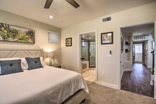 a bedroom with a large bed and a bathroom at Sunny San Diego Escape Less Than 2 Miles to Pacific Beach! in San Diego