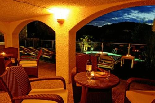 a patio with a table and chairs and a view at Casa Antonelli in Malcesine