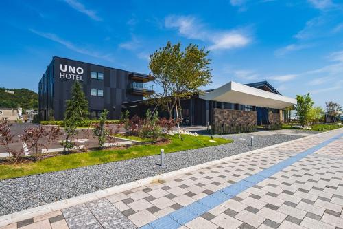 a building with a sign that reads uno hotel at UNO HOTEL in Tamano