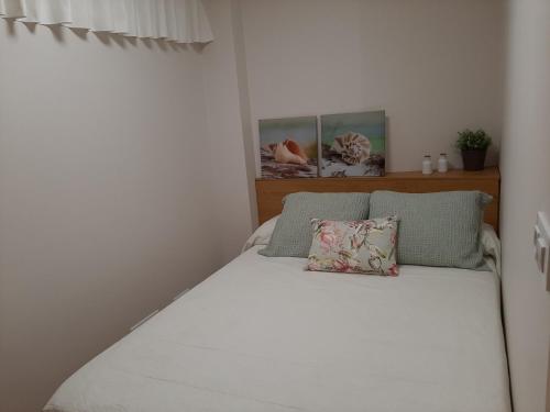 Ένα ή περισσότερα κρεβάτια σε δωμάτιο στο Bonito apartamento en O Grove