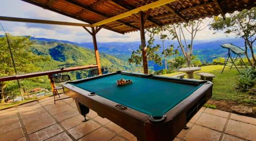 a pool table on a patio with a view at La Flor de Loto in Cartago