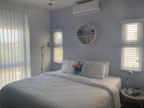 Postel nebo postele na pokoji v ubytování Jaco Lapa Living F2